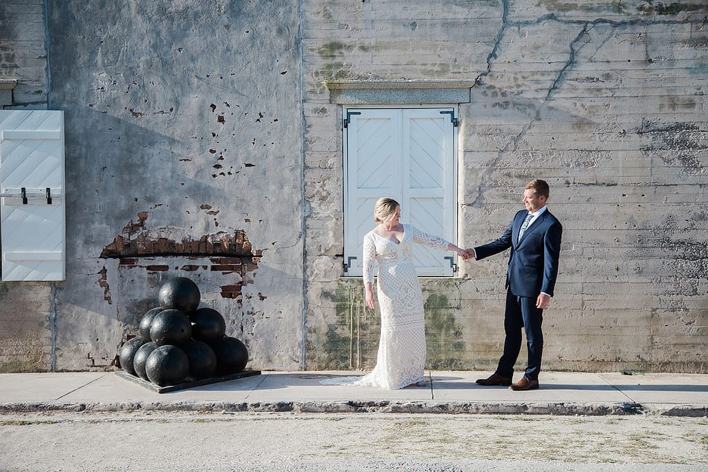 Couple posing playfully in Fort Zachary Taylor's fort.