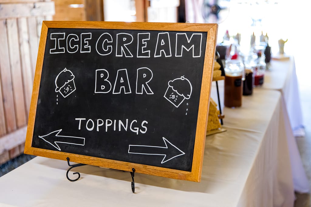 A sign for an ice cream bar at a wedding