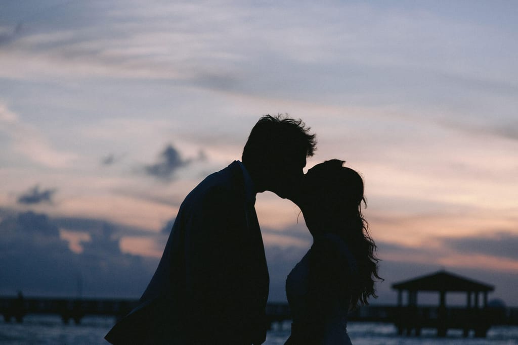 a couple kisses at sunset in key west