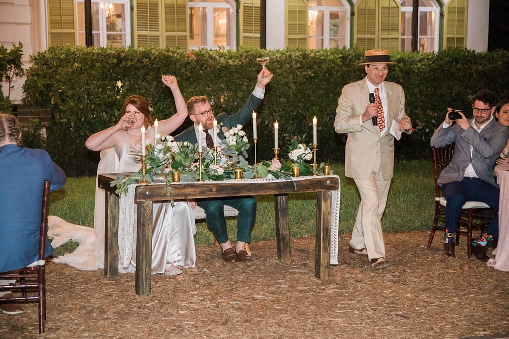 A wedding couple shares a toast, grateful that they were able to hire wedding vendors from afar and host their dream wedding. 
