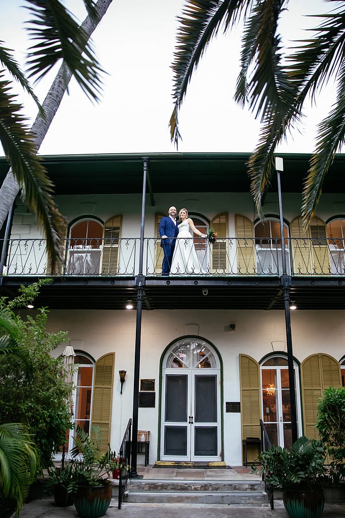 A wedding couples enjoys the history and beauty of the Hemingway Home