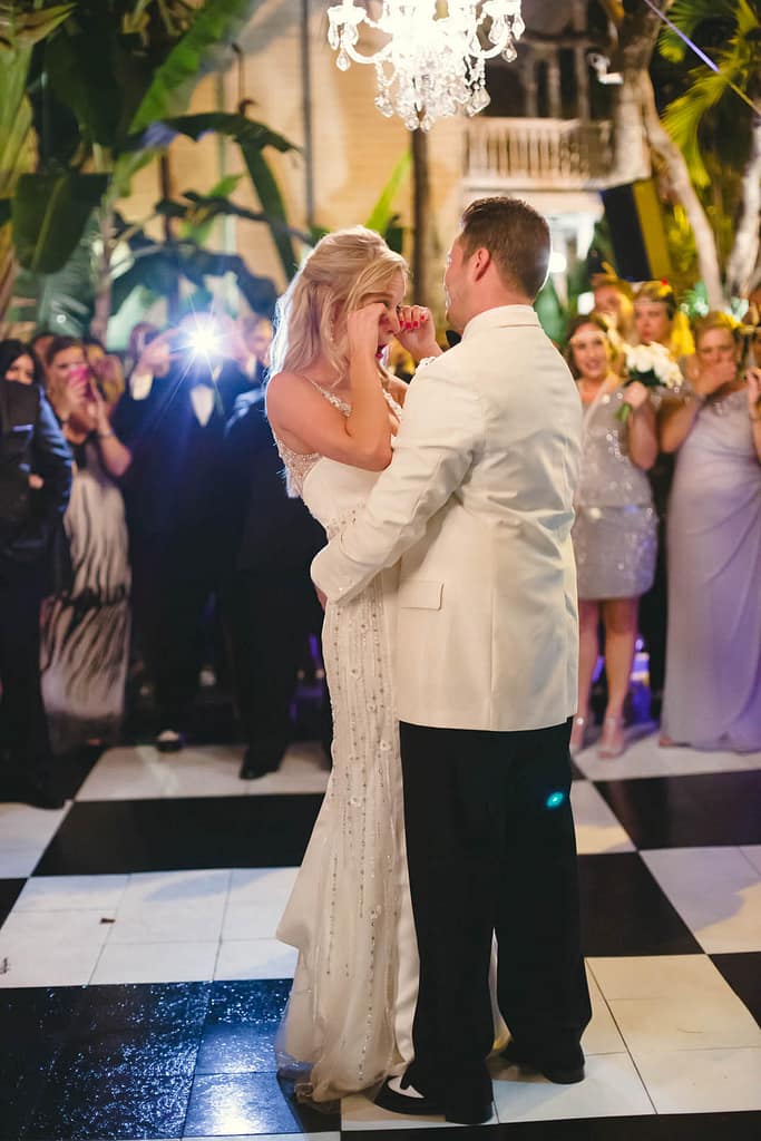 A bride cries during the couple's first dance. A perfect moment for a Key West videographer to capture.