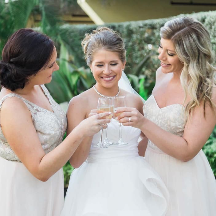 Champagne toasts with her girls at a wedding.
