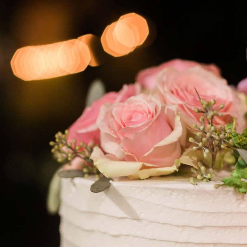Beautiful floral decorations on top of wedding cake